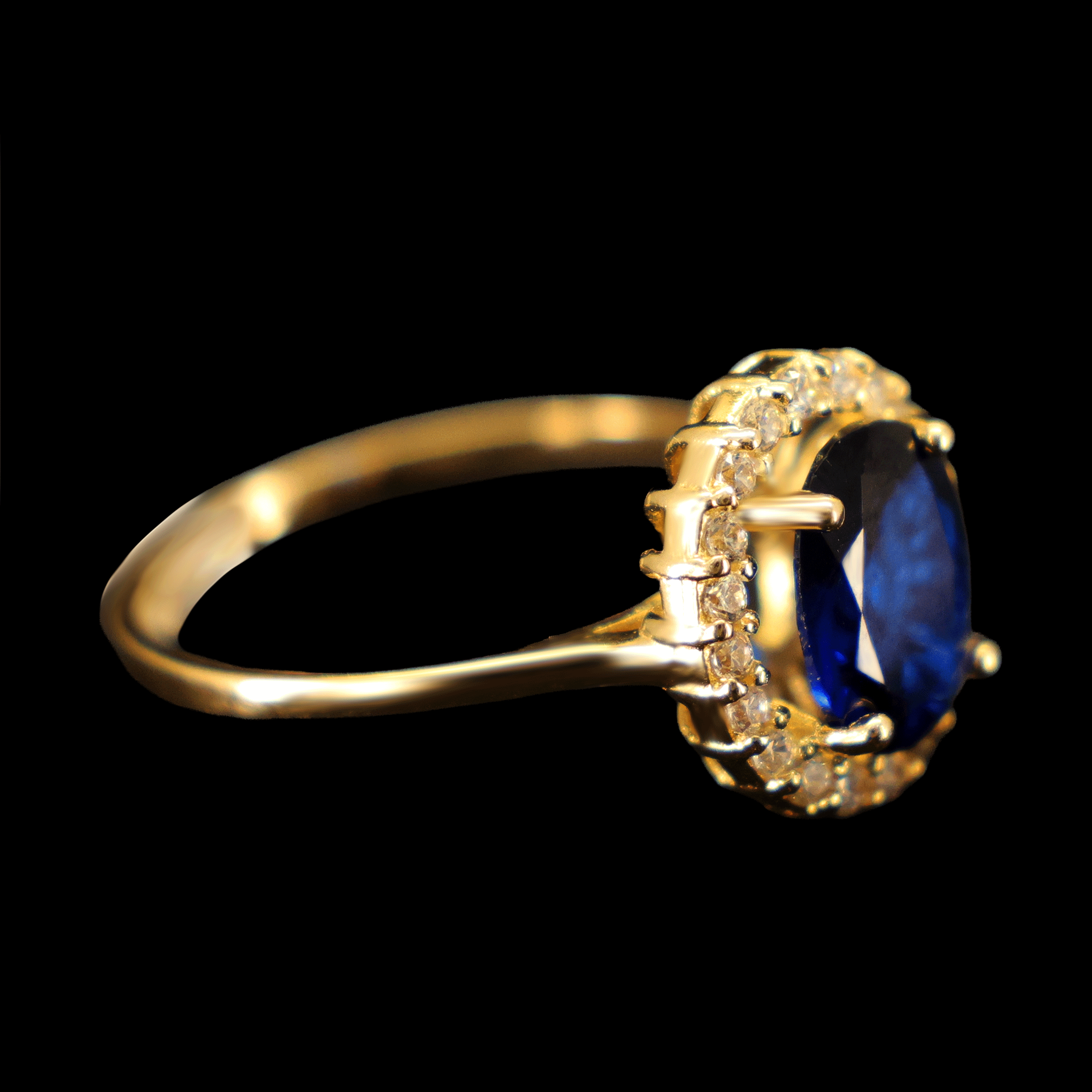 ANILLO ZN OVALADA AZUL BISEL EN BLANCO 10K