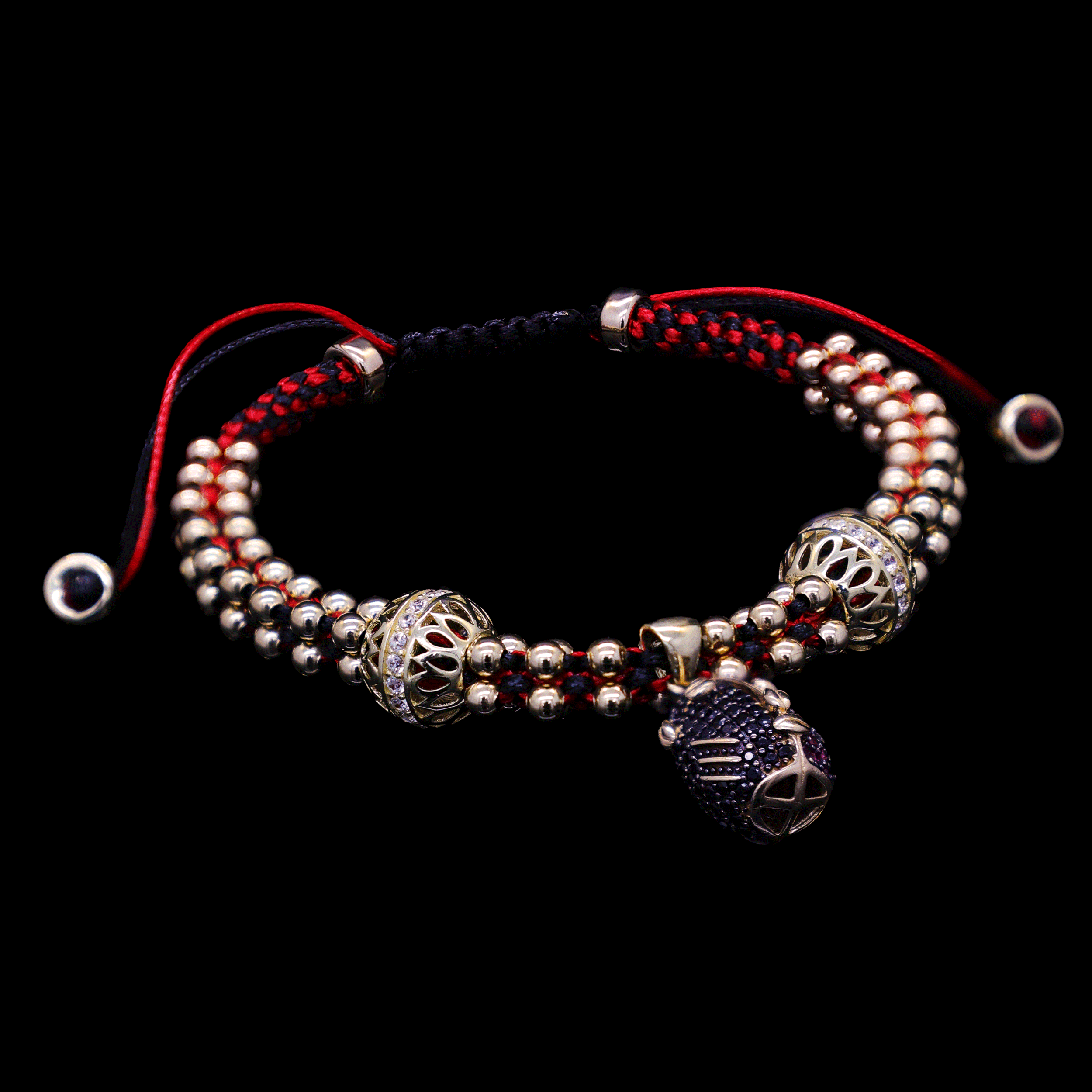 PULCERA TEJIDA ROJO /NEGRO DIJE ELEGGUA 10K